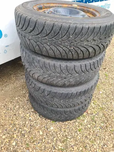 Set of 4, goodyear ultra grip ice,winter tires. 95% tread. 5 bolt pattern 109 mm fits ford models an...
