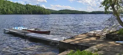 This 2 bedroom plus sofa, solar powered cottage a truly green escape.The lake has a sandy bottom wit...