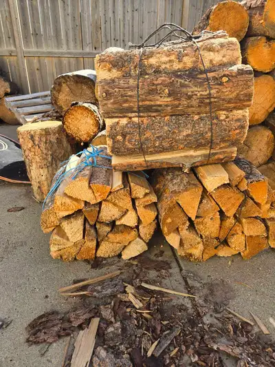Large firewood bundles Dry ready to burn $15 per bundle $40 for 3 bundles Text 403-586-1843