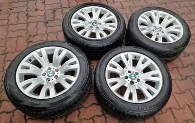 Set of 4 OEM BMW X5 rims and tires This is a staggered set up Two tires are 285/45R19 Two tires are...