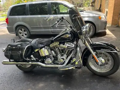 2013 Heritage Softail Classic in mint condition. Led lighting extra chrome and dual Bassani exhaust...