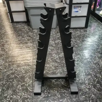 Dumbbell stand holds five pairs of dumbbells, for a total of ten. It's 26 inches high and 14 in wide...