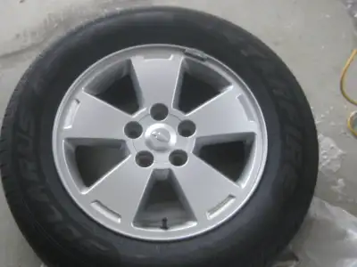 4, 225/20R16 tires and aluminum rims and storage rack, Came off Impala , average tread depth .210. $...