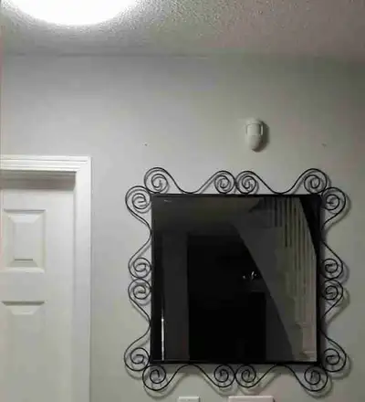 Add a touch of elegance to your home with this Ikea discontinued Black Metal frame mirror, featuring...