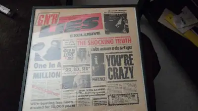 Own a piece of rock history with this framed Guns N' Roses "Lies" album! This album commemorates the...