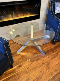 REDUCED: Glass coffee table, circular like new. 