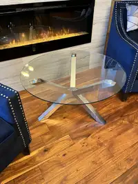 REDUCED: Glass coffee table, circular like new. 