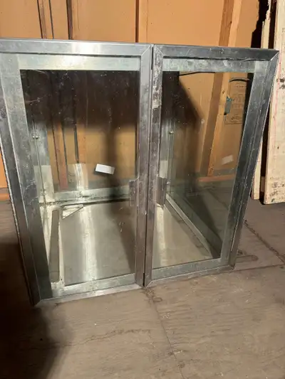 24” stainless steel and glass display 24” x 24” x 25” 2 hinged doors $100