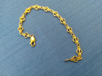Yellow gold bracelet 10K .7  inches. 6.9 grams...Width 6.5 mm .T