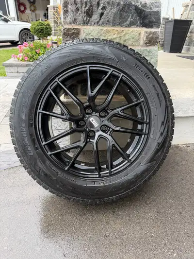 These Toyo Observe GSi-6 LS winter tires, size 245/60R18 105H, are mounted on premium black alloy ri...