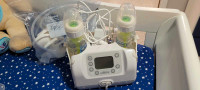 Double electric breast pump, storage bags and nursing pads