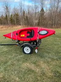 Two Equinox 10 ft. kayaks and trailer