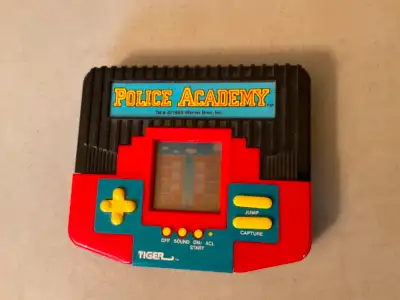 Police Academy Handheld Electronic Video Game - $45, View more
