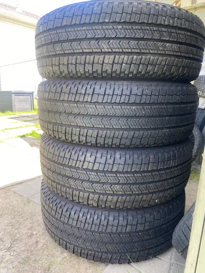 A set of 4 Michelin All Season Truck Tires with lots of tread pretty evenly worn no plugs or patches...