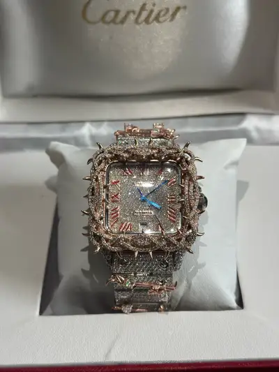 Make a bold statement with this fully iced-out timepiece, designed for those who appreciate standout...