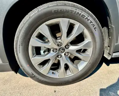 These are Continental CrossContact LX20 255/55R20 tires mounted on 20-inch rims that originally came...