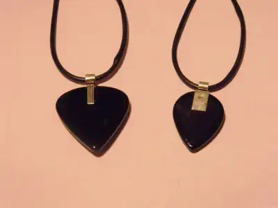 2 black polished stone, leather and sterling silver necklaces, View more