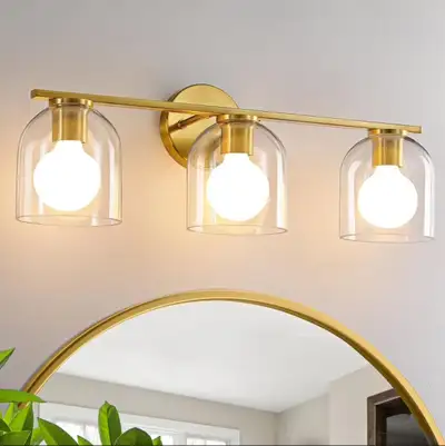 Illuminate your bathroom with this brand new, never-installed, 3-light gold vanity fixture, featurin...