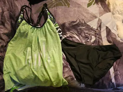 Green women bathing suit. Brand new. Bottoms still have liner on them. Size medium