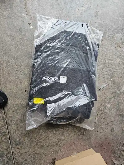 Genuine Toyota RAV4 black carpet floor mats, consistent with models from 2019–2025.The set includes...