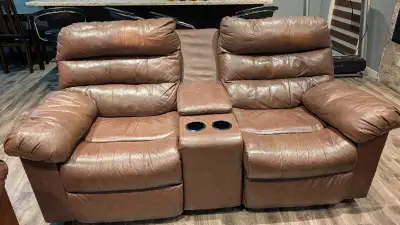 Ashley's 3 Piece Reclining Leather Sofa Set + Coffee Table, View more