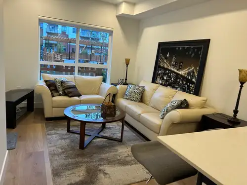 FULLY FURNISHED! FAUNA’s ground floor newer (2004) modern 1 bedroom + Den Condo, walk-in closet,1 fu...