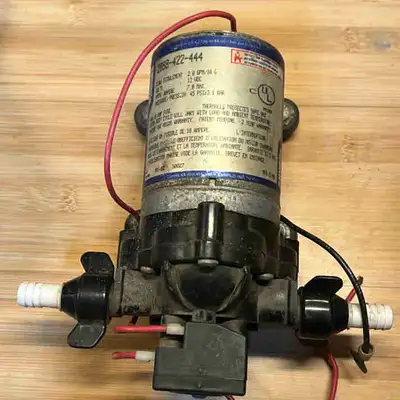 I'm selling a used SHURflo RV water pump, ideal for your mobile home or camper. This pump is in work...