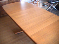 Quality teak dining table with two leaves