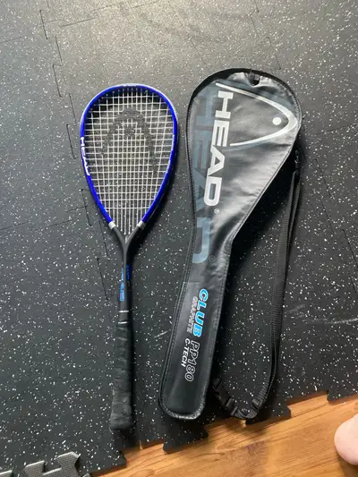 Used squash racket with bag