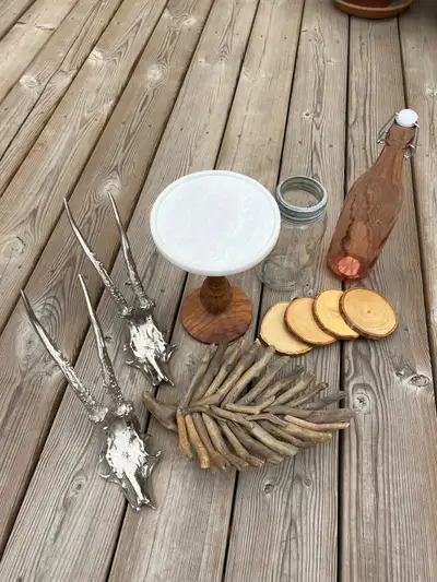 Assorted decor plates, antler hooks, bottles, coasters, View more