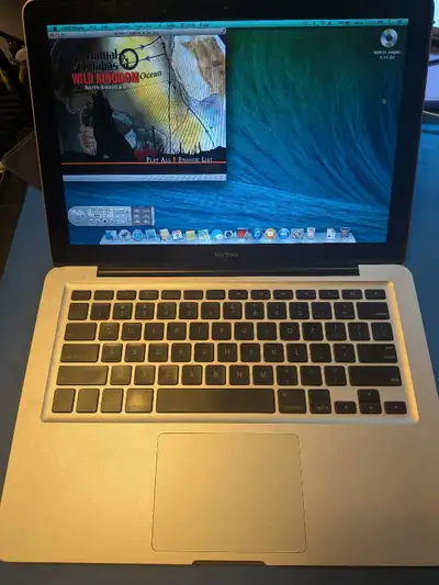 13" model with the removable bottom panel. A couple minor dents but in good condition overall. Scree...