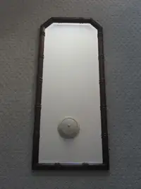 Decorative Bevelled Mirror With A Wooden Frame