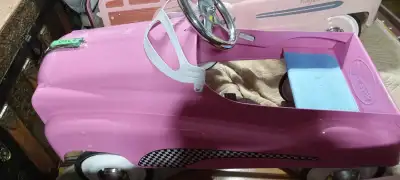Excellent pink pedal car, never used, all original, (instep) located Paris Ont, pick up only