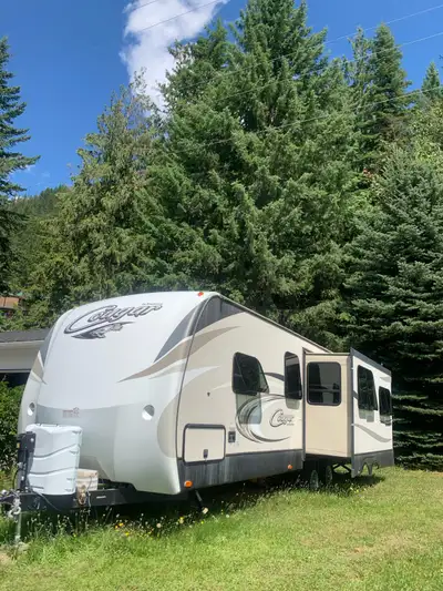 Like new cougar travel trailer with single slide. 27 foot , 3 season spray foam insulation, solar pa...