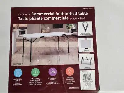 I'm offering a new, commercial grade, fold-in-half table, measuring 1.83 meters (6 feet) in length....