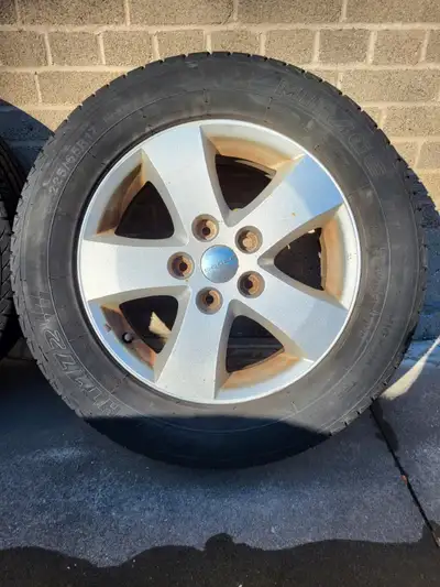 Four (4) tires and aluminum rims with tire pressure sensors