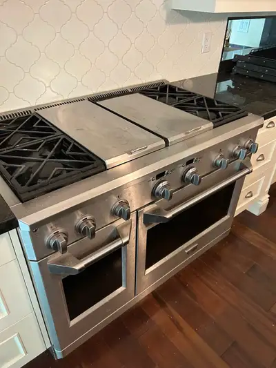 GE Monogram Gas Range and Electric Ovens. Large range - everything working and recently serviced. Co...