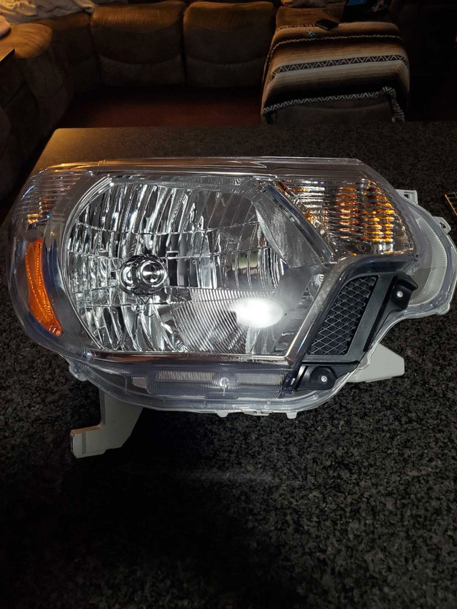 OEM headlight Tacoma 2012 in Auto Body Parts in Cambridge