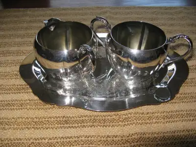 Silver plated serving sets., View more