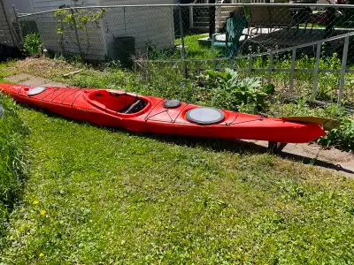 17’ sea Kayak with 3 water- tight hatches, & flip down rudder. J hooks for transport and spay skirt....