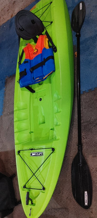 Kayak with paddle and life jacket