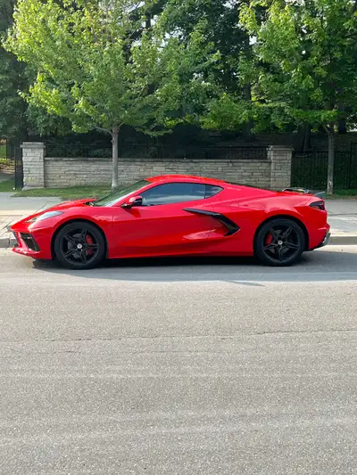 Experience the thrill of driving this stunning, red 2020 Chevrolet C8 Corvette, a true sports car ic...