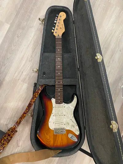 1997 model, solid wood body (heavy), pearloid pickguard, made in Korea, great sound/condition. Comes...
