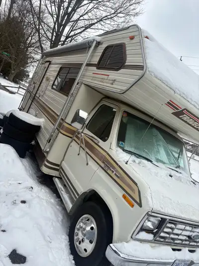 1985 Ford Motorhome. It drives everything works fridge stove microwave ECT. Double bed above the cab...