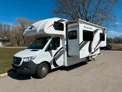 Experience luxury and reliability with this meticulously maintained motorhome. Four Winds warranty u...