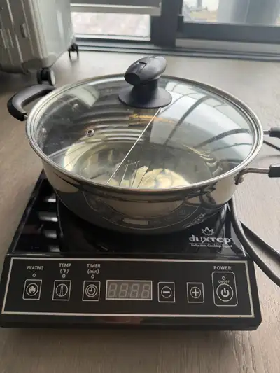 Enjoy delicious hotpot meals with this used Duxtop induction cooktop and stainless steel pot. The co...