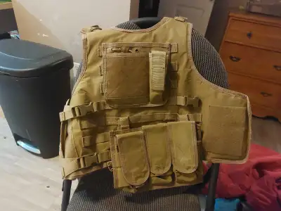 This tactical vest is perfect for military simulations or hunting, offering modular attachments and...