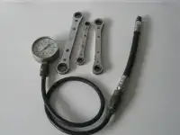 Compression tester, wrenches.