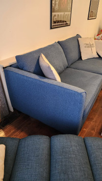 Cyan (aqua) color sofa with charging shelf