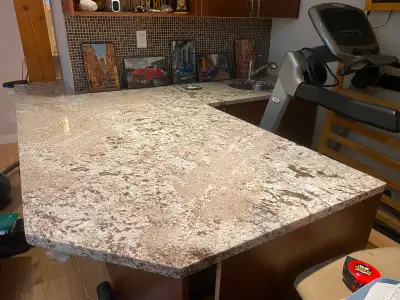 Just over 15 sq ft rectangular slab. Alaska White granite. Very heavy and requires moving. Beautiful...